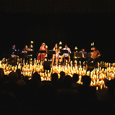 musicians surrounded by candles